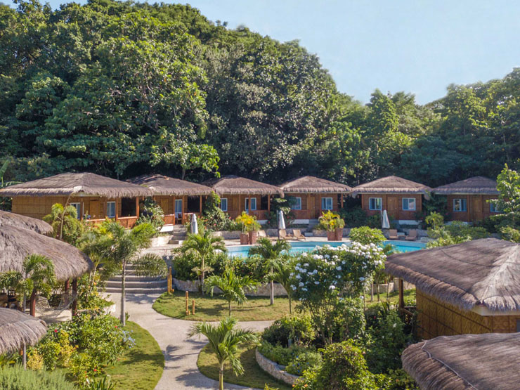 Some bungalows surrounding the pool at Magic Oceans Dive Resort.