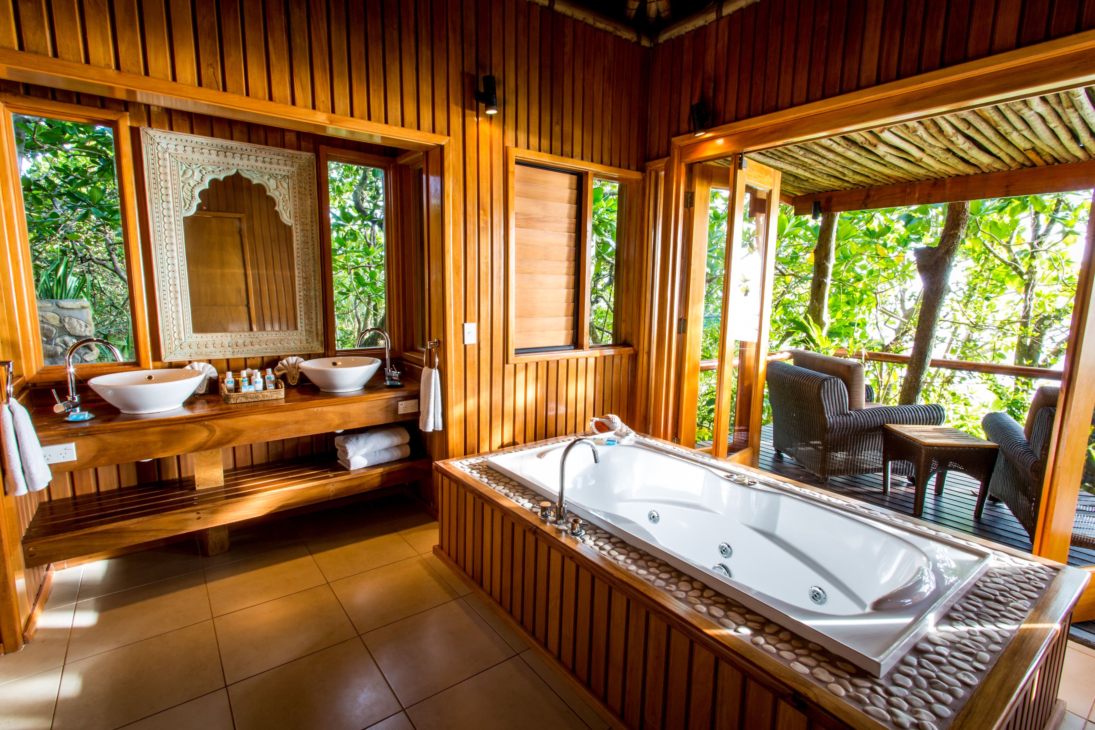 Warm artisanal woodwork, intimate soak tubs and private verandahs set the stage for relaxation in Namale's private bures.