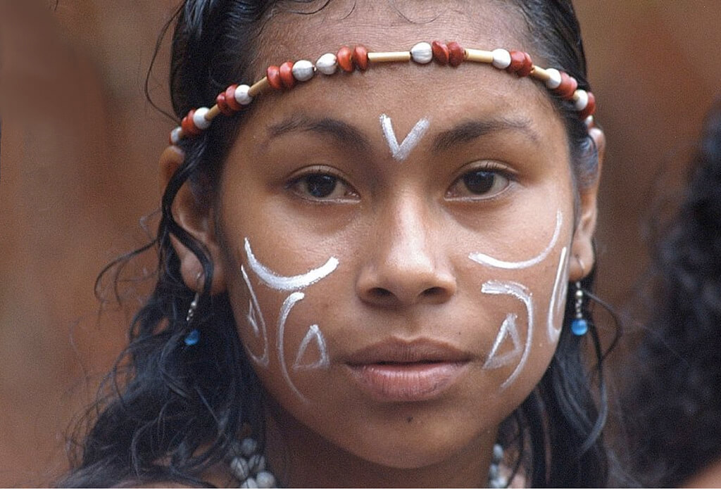 A Kalinago girl wearing traditional ornamentation.