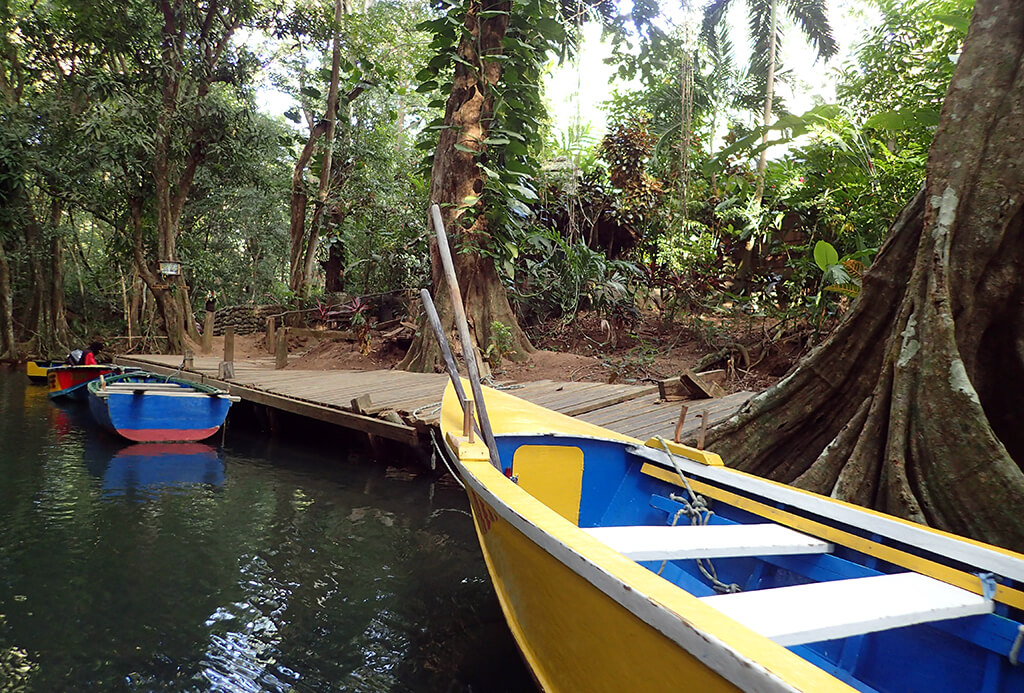 Colorful rowboats sit ready to ferry visitors on the Indian River.