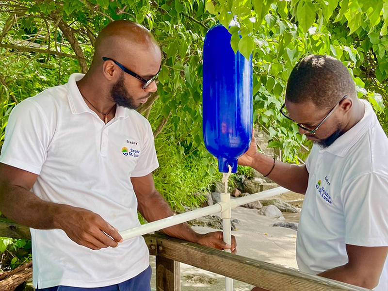 The Dive ST. Lucia team assembles a frame for the coral nursery.