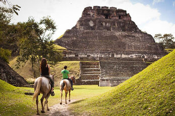 Horseback tours are a popular way to explore the Belize outback.
