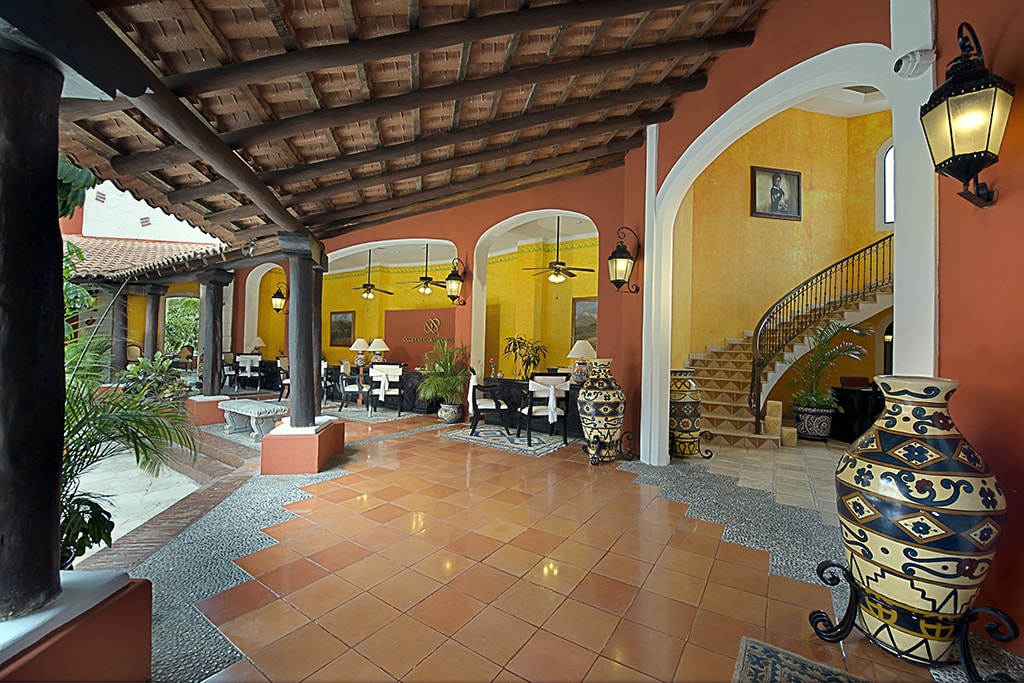 Warm tones and shaded verandahs create an inviting and relaxing atmosphere at the Occidental Cozumel Resort.