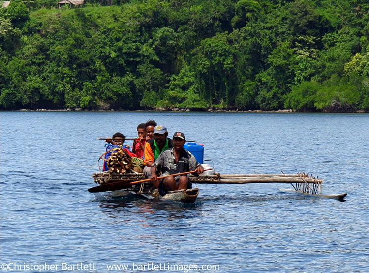 Traditional dugout canoes are still a primary means of transportation along the PNG coast and on the Sepik River.