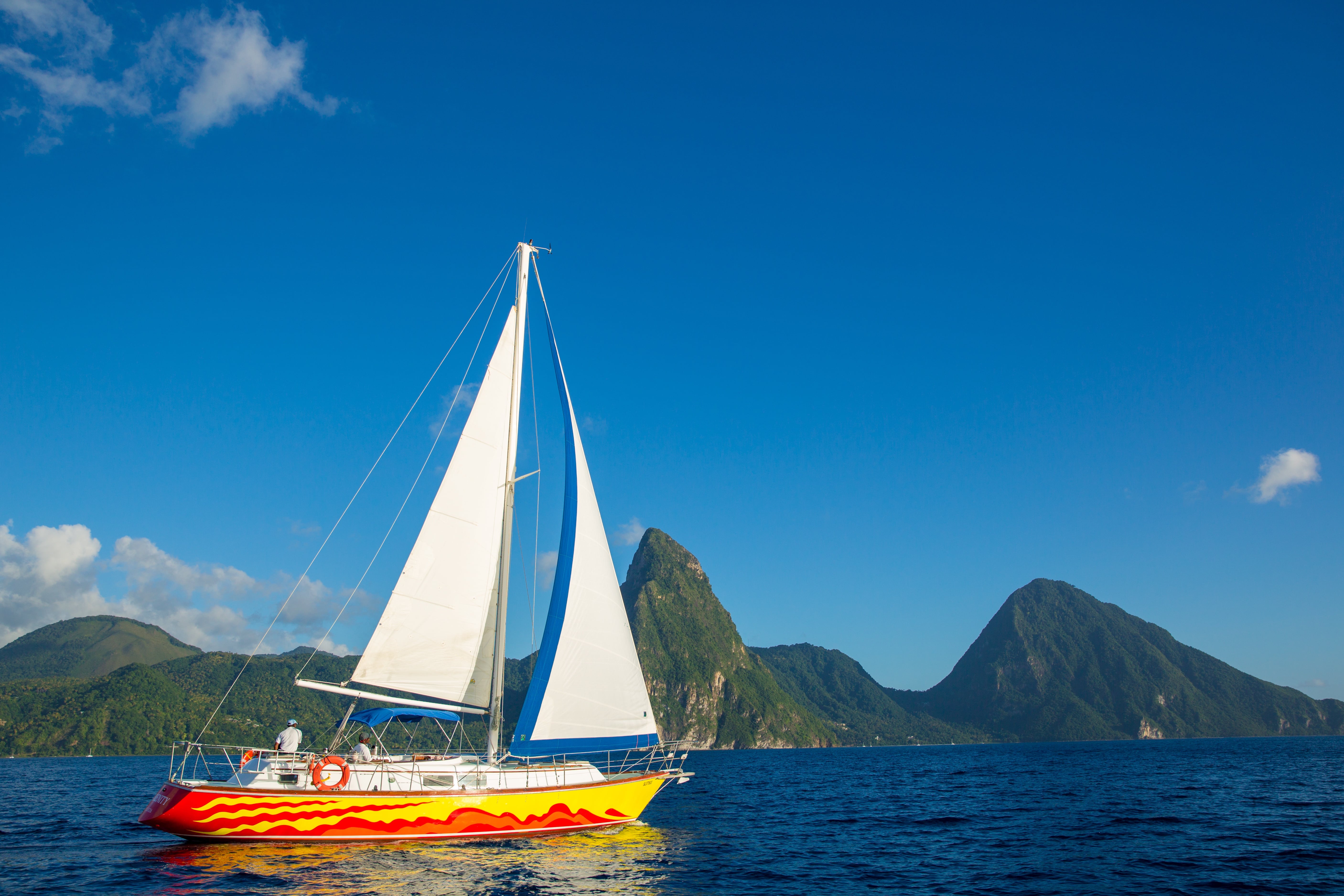 St. Lucia's west coast is sheltered from prevailing trade winds, providing calm, clear waters ideal for relaxing sailing trips.