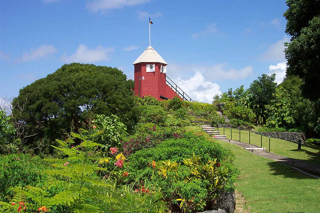 A hike to the summit of Gun Hill Signal Station passes through manicured gardens to deliver captivating views of the entire island.