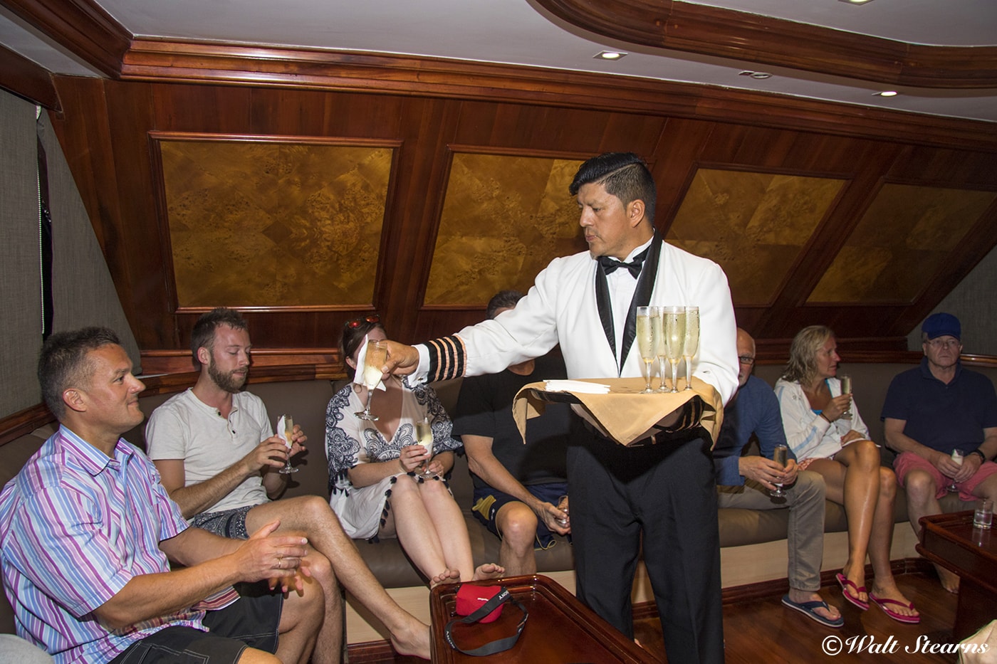 Divers gather for a post-dive libation in the main saloon, which is the social hub of the Galapagos Sky.