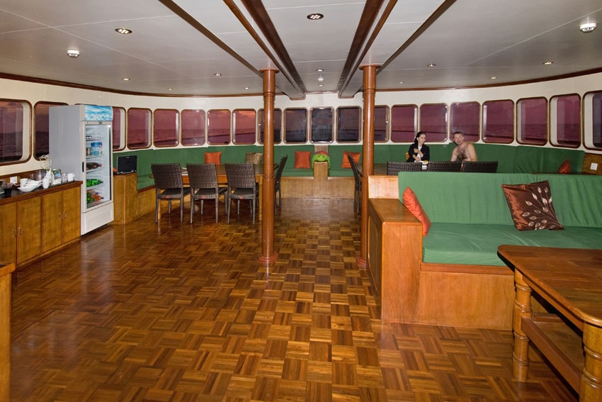 The indoor lounge on the Carpe Vita Explorer is set on the forward portion of the main deck, with wrap-around windows.