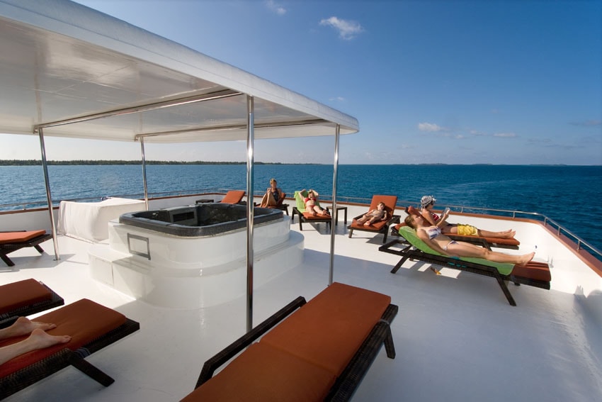 The top deck of the Carpe Vita Explorer includes a sun lounge and hot tub.