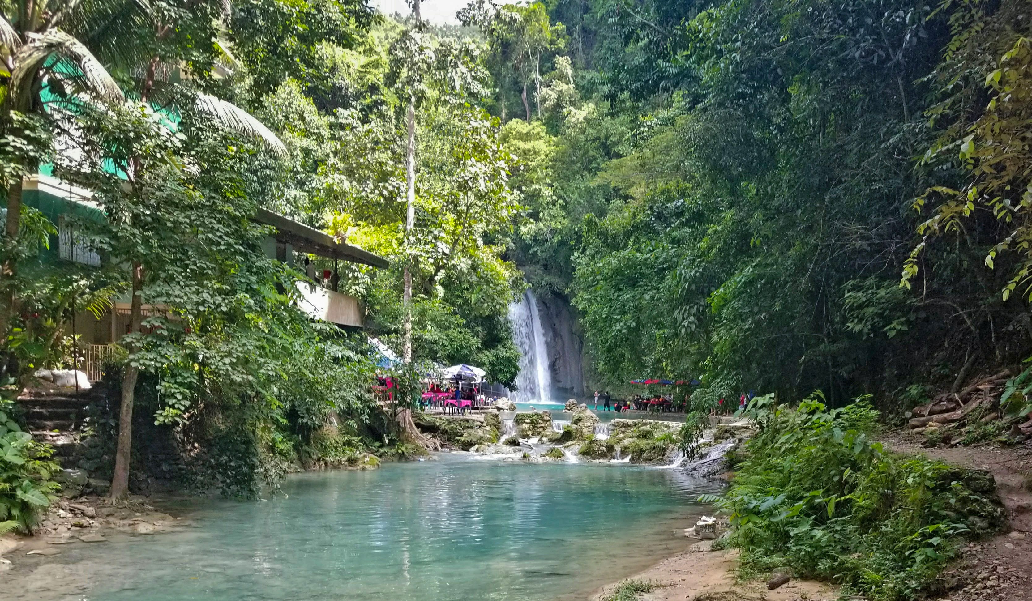 Day trips to view the whale sharks of Oslob are often combined with a stop at Kawasan Falls. This three-tiered cascade flows from mountain springs deep in the jungles of Cebu Island.