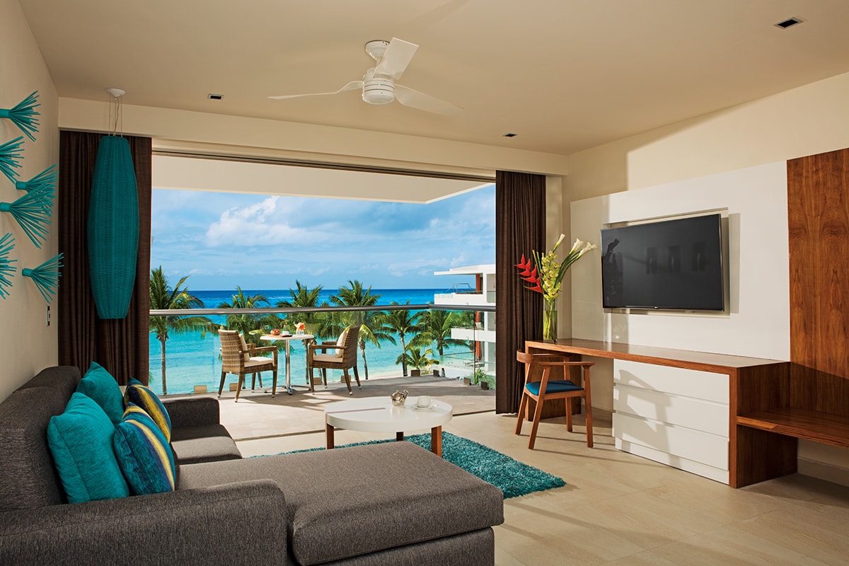 An ocean-view suite at Secrets Aura.