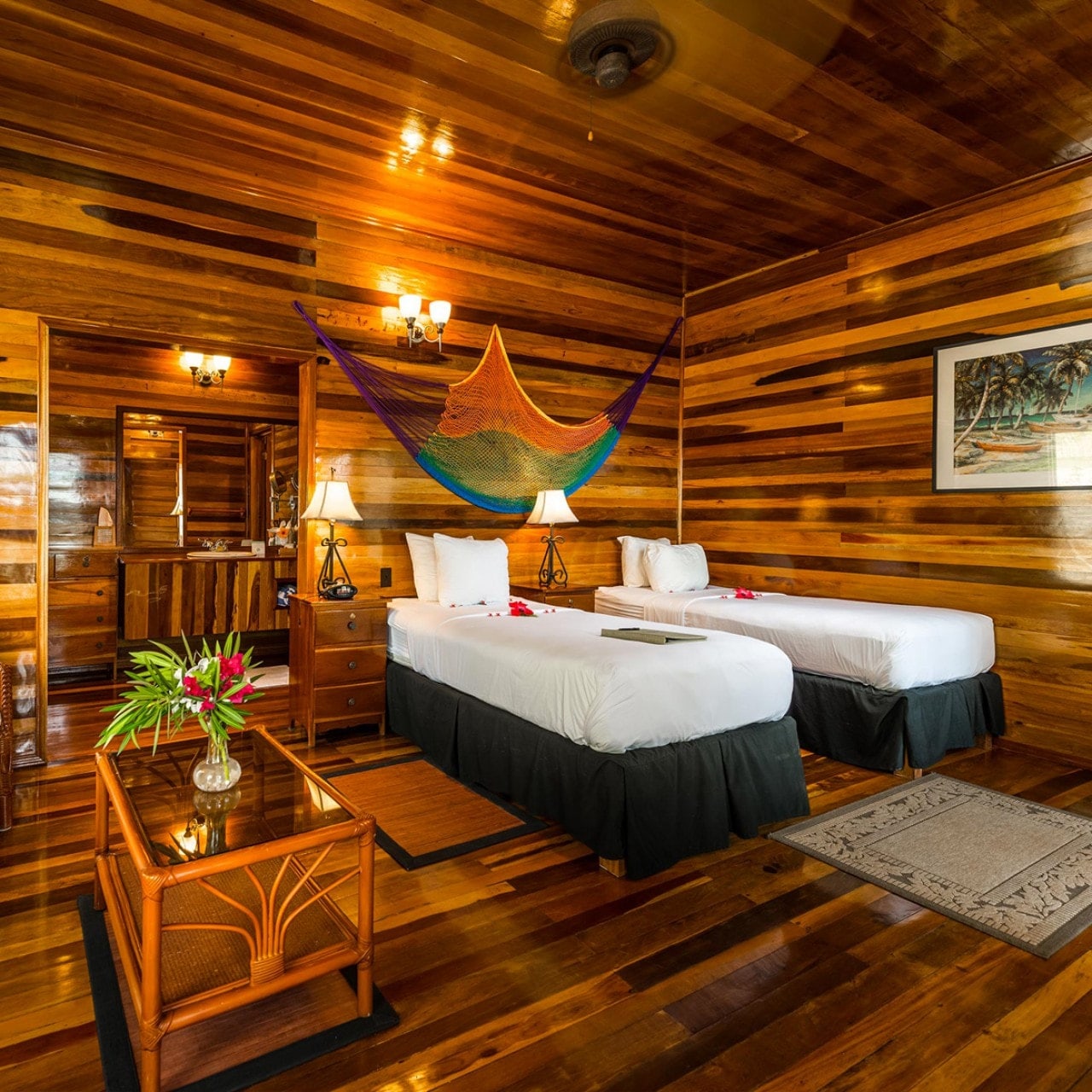 Rich mahogany and teak woodwork add a warm ambiance to a Deluxe Room. Guests have the option of twin beds or a single king.