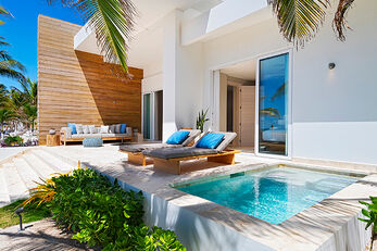 Beachfront Villas sit just steps from the water, with private terraces and plunge pools.