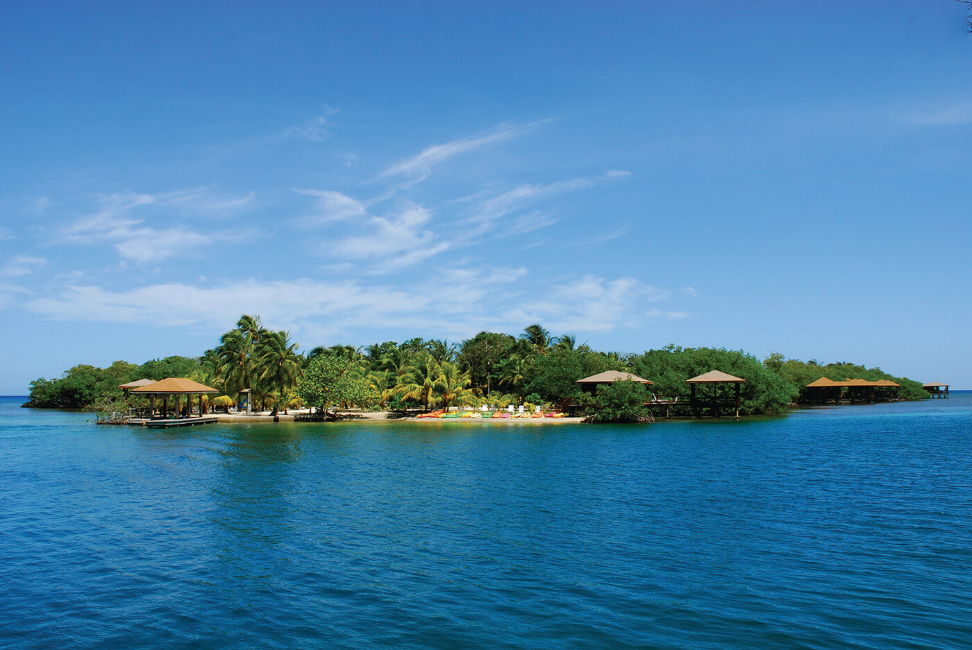 A view of the beach at Anthony's Key, with kayaks lined up for guest use.