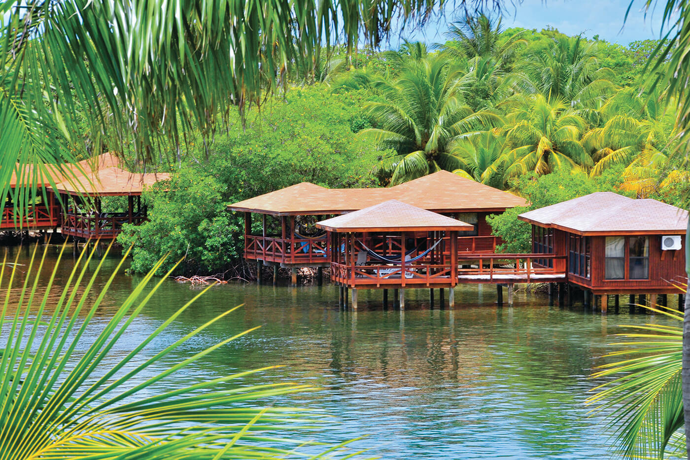 Bungalows at Anthony's Key are set on piling at water's edge, with covered decks extending into the lagoon.