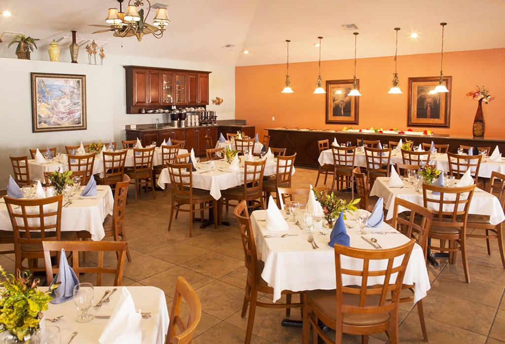 The dining room of the Palms Caribbean Restaurant, which serves high-quality buffet-style meals daily.