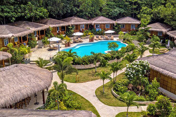 Resort bungalows cluster around the swimming pool.