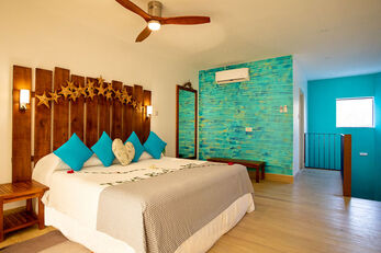 Guest accommodations at True Blue Bay employ colors and styles that evoke a sense of whimsical relaxation.