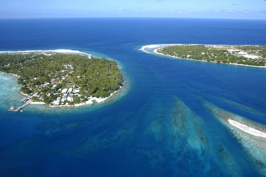 An aerial view of Rangiroa Atoll shows the line of small islands known as Motus that line the edges of the lagoon. More than 400 Motus ring the atoll.