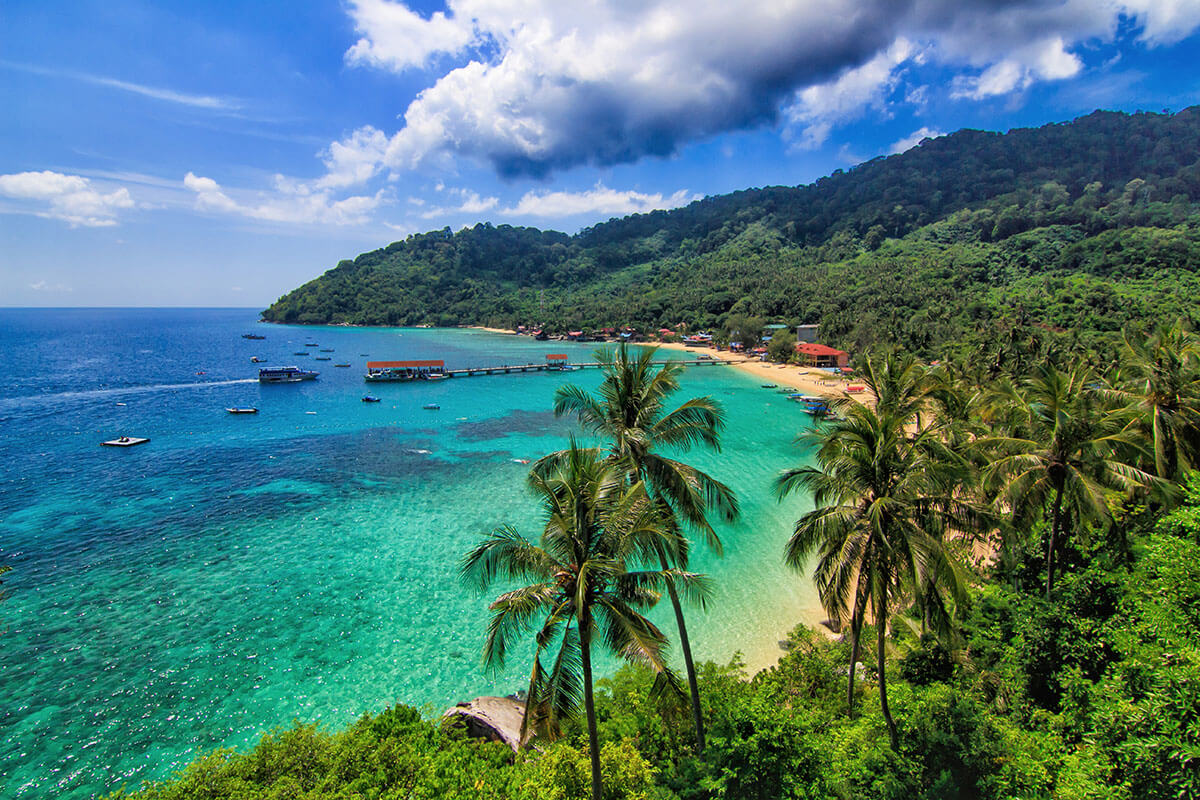 Tioman Island is surrounded by 18 beaches, many of which are undeveloped, and can only be reached by boat.